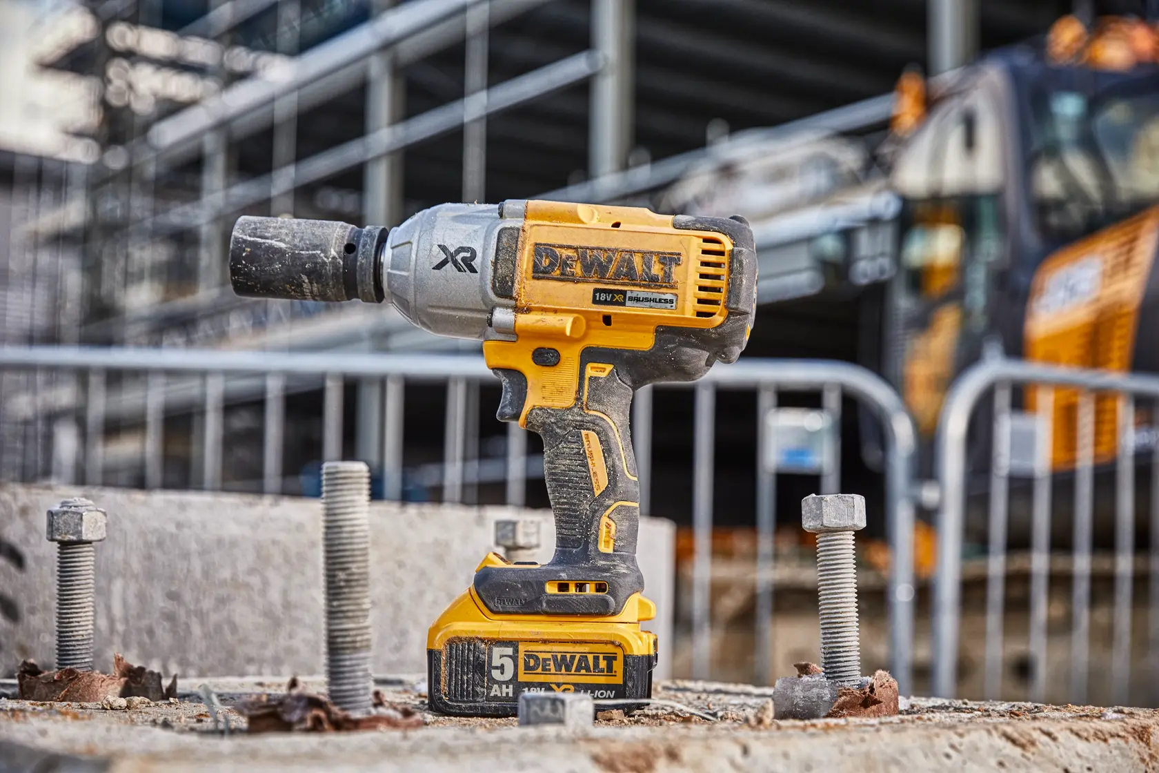 DEWALT cordless impact wrench DCF897N-XJ, DCF897N on construction site with bolts, photo outdoor.