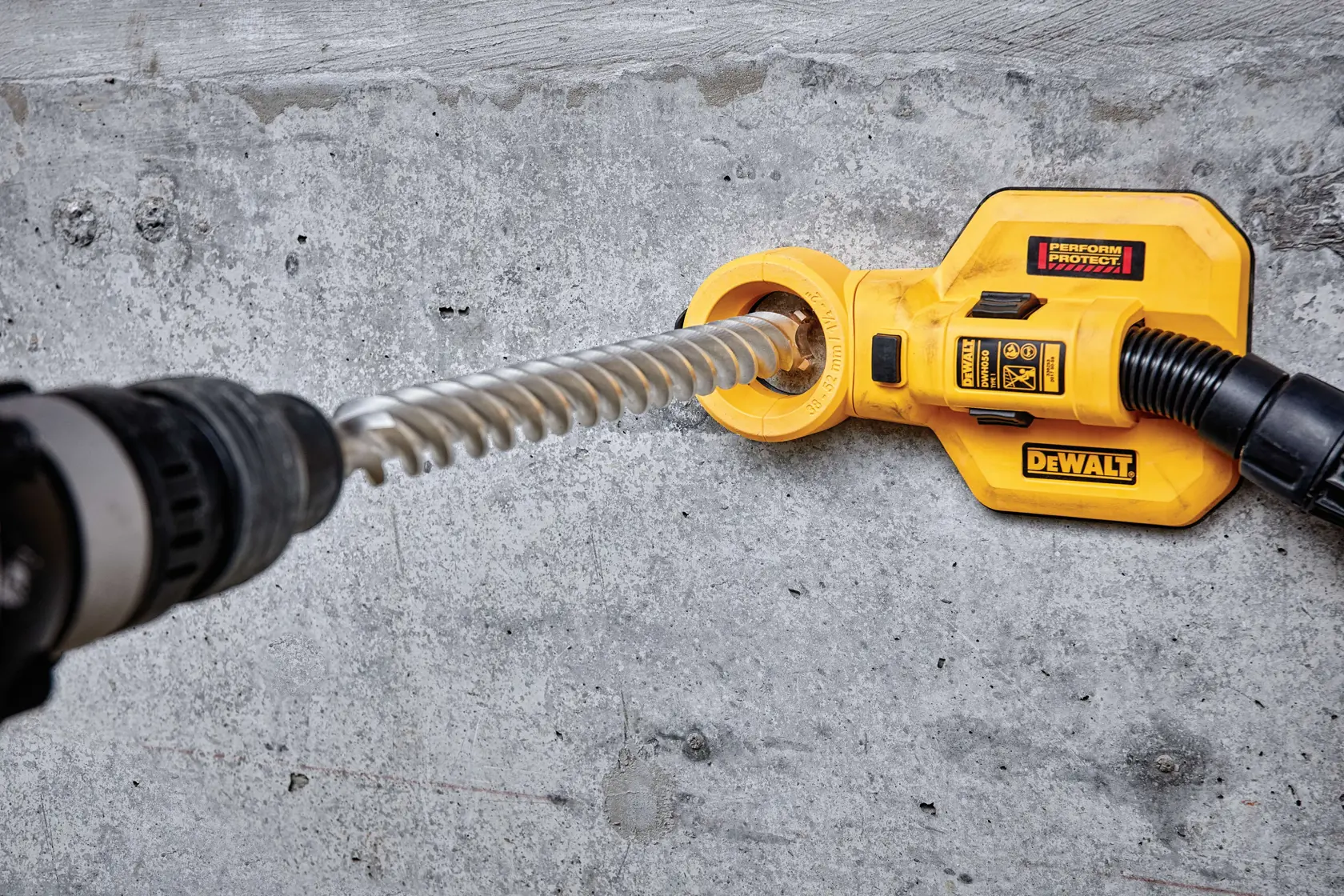 DEWALT DT60845 dust extractor attached to a drill, used for concrete drilling.
