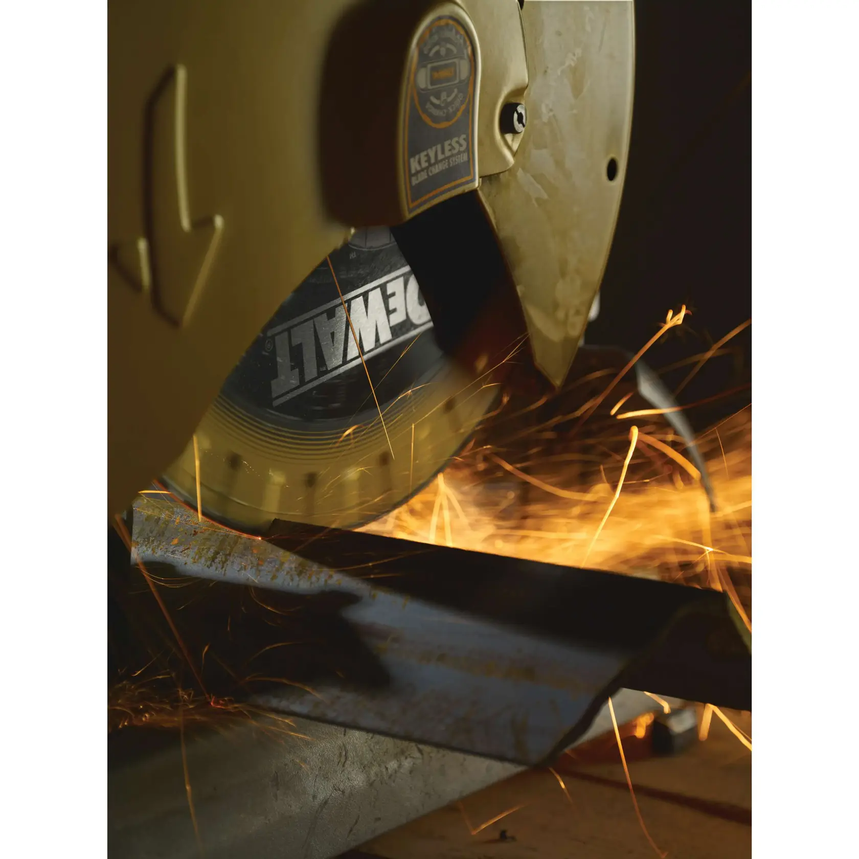 Close-up of a DEWALT metal cutting saw in operation, producing sparks while cutting through a piece of metal.