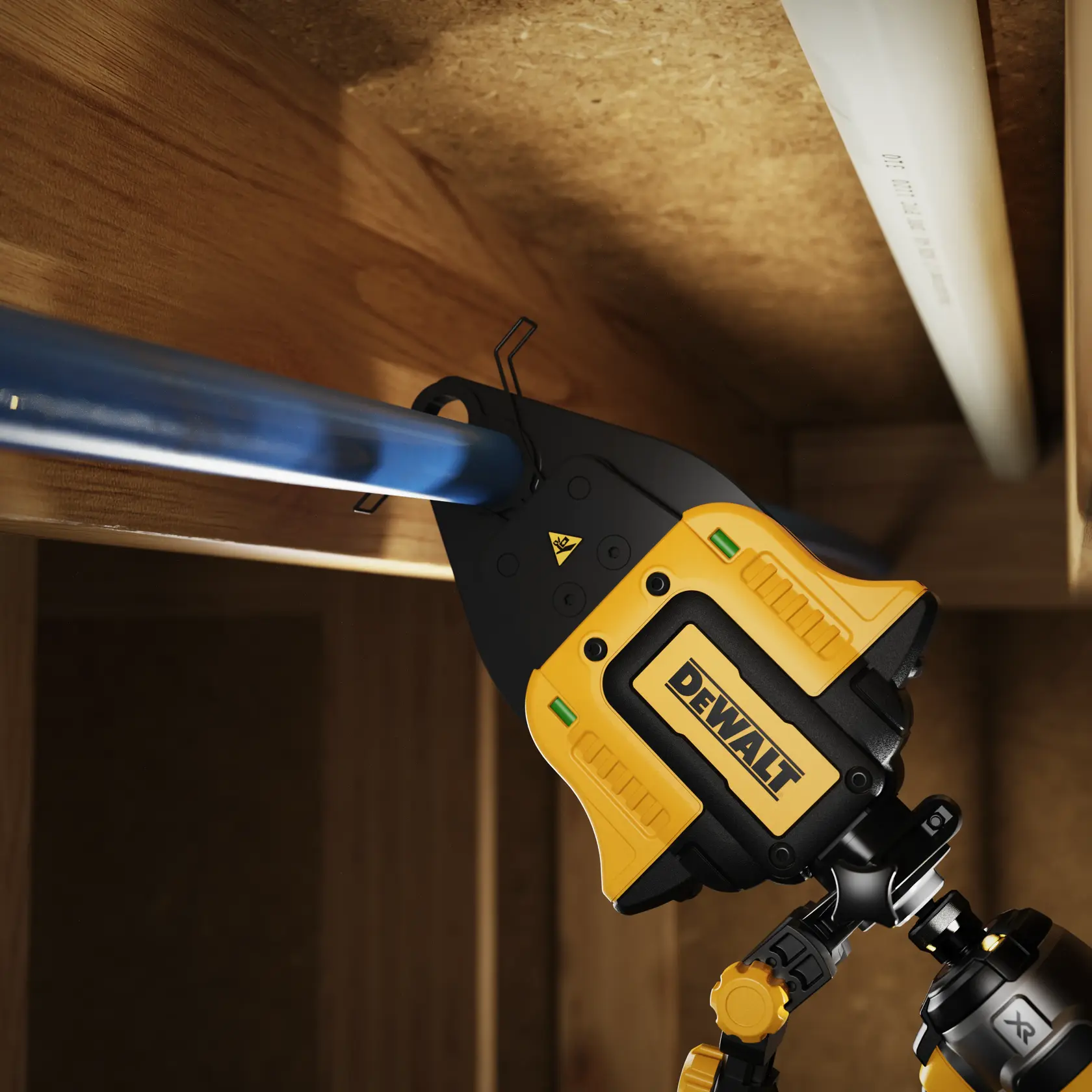DEWALT photography tool mounted on a blue pipe in a wooden structure for precise alignment or measurement.